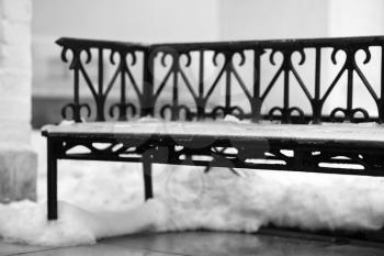Vintage metal bench in snow bokeh backdrop hd