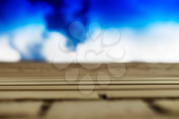Horizontal brick wall with blue sky motion blur background hd