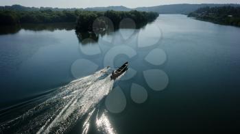 Indian boatman driving lake floating
