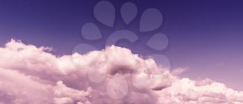 Horizontal vivid purple tinted  wide pano bottom aligned cloudscape design element background backdrop