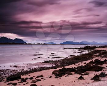 Horizontal pink vibrant evening at Norway fjords beach landscape background backdrop