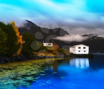 Horizontal vivid Norway autumn landscape with reflections background backdrop