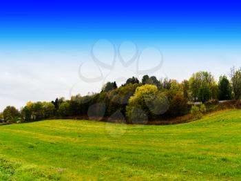 Horizontal danish field hills with blue sky background backdrop