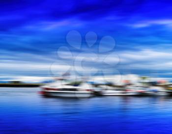 Horizontal blue vivid Norway ships at pier motion blur abstraction landscape background backdrop