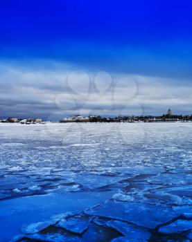 Vertical vivid ice on Finland lake landscape background backdrop