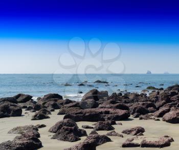 Horizontal vivid stony beach ocean horizon landscape background backdrop