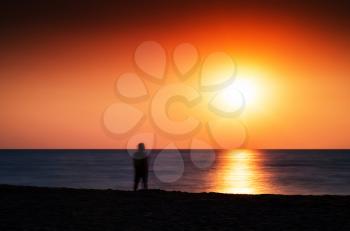 Horizontal vivid meeting ocean sunset lonely man abstraction landscape background backdrop 