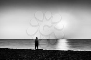 Horizontal vivid black and white meeting ocean sunset lonely man abstraction landscape background backdrop 