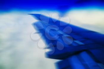 Horizontal vivid blue travel plane jet wing abstraction transportation background backdrop