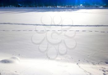 Footprints on smooth snow landscape background hd