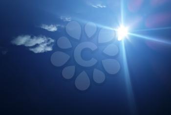 Sun rays in the blue sky background hd