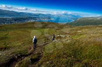 Couple descending from Norway mountain background hd