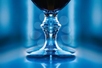 Vertical symmetric glass of wine abstraction backdrop