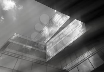 Diagonal black and white office building with sun beams background