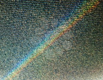 Diagonal spectrum beams on office carpeting backdrop
