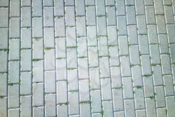 Diagonal tiles with grass texture background