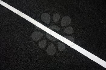 Marking line on the asphalt road background