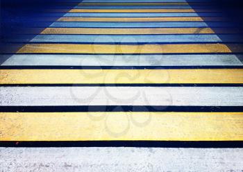 Yellow pedestrian crossing close up background