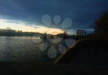 Ferry-boat during river sunset landscape background