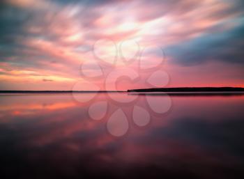 Vivid sunset sunrise horizon lake reflections landscape 