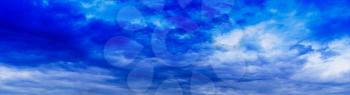 Horizontal wide panorama blue vivid cloudscape background backdrop