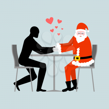 Christmas Lover. Lovers in cafe. Man and Santa Claus sitting at table. Christmas in restaurant. Romantic rendezvous are new year
