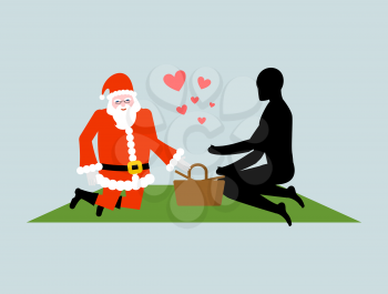 Christmas Lover. Santa Claus on picnic. Rendezvous in Park. Meal in nature. Plaid and basket for food on lawn. Romantic New Year date.
