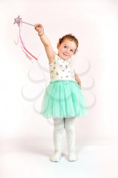 Fashion little girl in green dress, in catwalk model pose, stock photo. Image 01