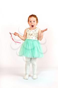 Fashion little girl in green dress, in catwalk model pose, stock photo. Image 02