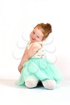 Fashion little girl in green dress, in catwalk model pose, stock photo. Image 06