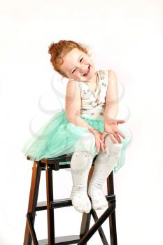 Fashion little girl in green dress, in catwalk model pose, stock photo. Image 08