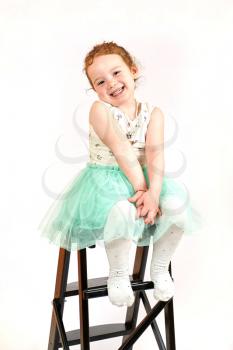 Fashion little girl in green dress, in catwalk model pose, stock photo. Image 09