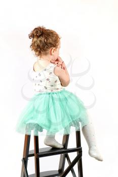Fashion little girl in green dress, in catwalk model pose, stock photo. Image 11