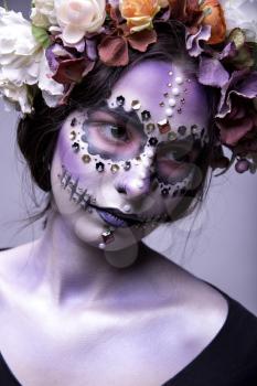 Portrait of a beautiful Halloween model with creative make up