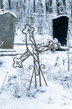 Old cemetery at abandoned  village in a winter day