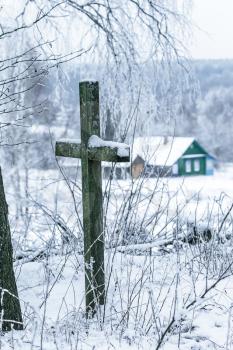 Old cemetery at abandoned  village in a winter day