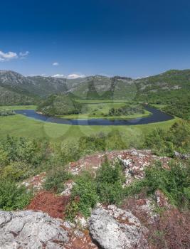 Panoramic view from above of Skadar lake and Crnojevica river in a national park, Montenegro, in a sunny summer day