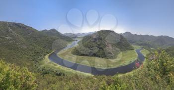 Panoramic view from above of the huge bend of Tsrnoyevicha river and the forest around, Rijeka Crnojevica in Montenegro