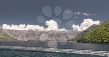 Panoramic view from the sea to the Kamenari-Lepetane Ferry crossing in the Bay of Kotor, Montenegro, in a sunny summer day.