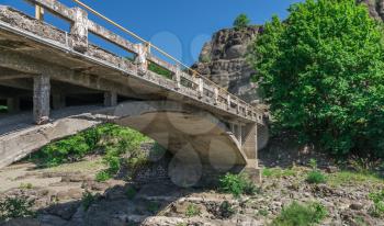 New bridge over the enetikos river with green water and  beautiful rock formations near Meteora in Greece