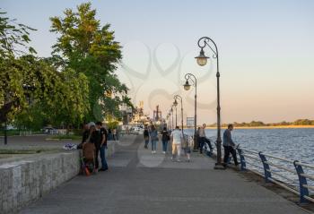 Kherson, Ukraine - 04.27.2019. People walk and relax on the promenade in Kherson, Ukraine,