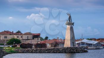 Nessebar, Bulgaria – 07.10.2019.  Monument to St Nicholas in front of the main entrance to the old town of Nessebar, Bulgaria on a sunny summer morning