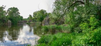 Southern Bug river in Mygiya village, Ukraine, on a sunny summer day