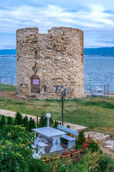 Nessebar, Bulgaria – 07.10.2019. Old Windmill on the promenade of Nessebar, Bulgaria, on a cloudy summer evening