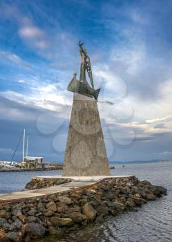 Nessebar, Bulgaria – 07.11.2019.  Monument to St Nicholas in front of the main entrance to the old town of Nessebar, Bulgaria on a sunny summer morning