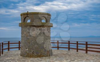 Nessebar, Bulgaria – 07.09.2019. Old tower on the promenade of Nessebar ancient city, Bulgaria, on a cloudy summer morning