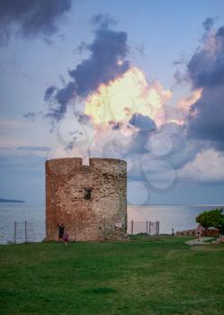 Nessebar, Bulgaria – 07.09.2019. Old Windmill on the promenade of Nessebar, Bulgaria, on a cloudy summer evening