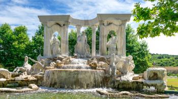 Ravadinovo, Bulgaria – 07.11.2019.  Large antique fountain in the form of a sculptural composition in the castle of Ravadinovo, Bulgaria, on a sunny summer day