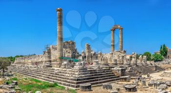 Didyma, Turkey – 2019-07-20. The southern flank of the temple of Apollo with the stadium at Didyma, Turkey, on a sunny summer day
