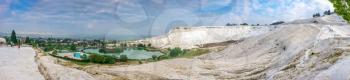 Pamukkale, Turkey – 07.15.2019. White mountain and green lake in Pamukkale. Panoramic view from above on a summer morning.